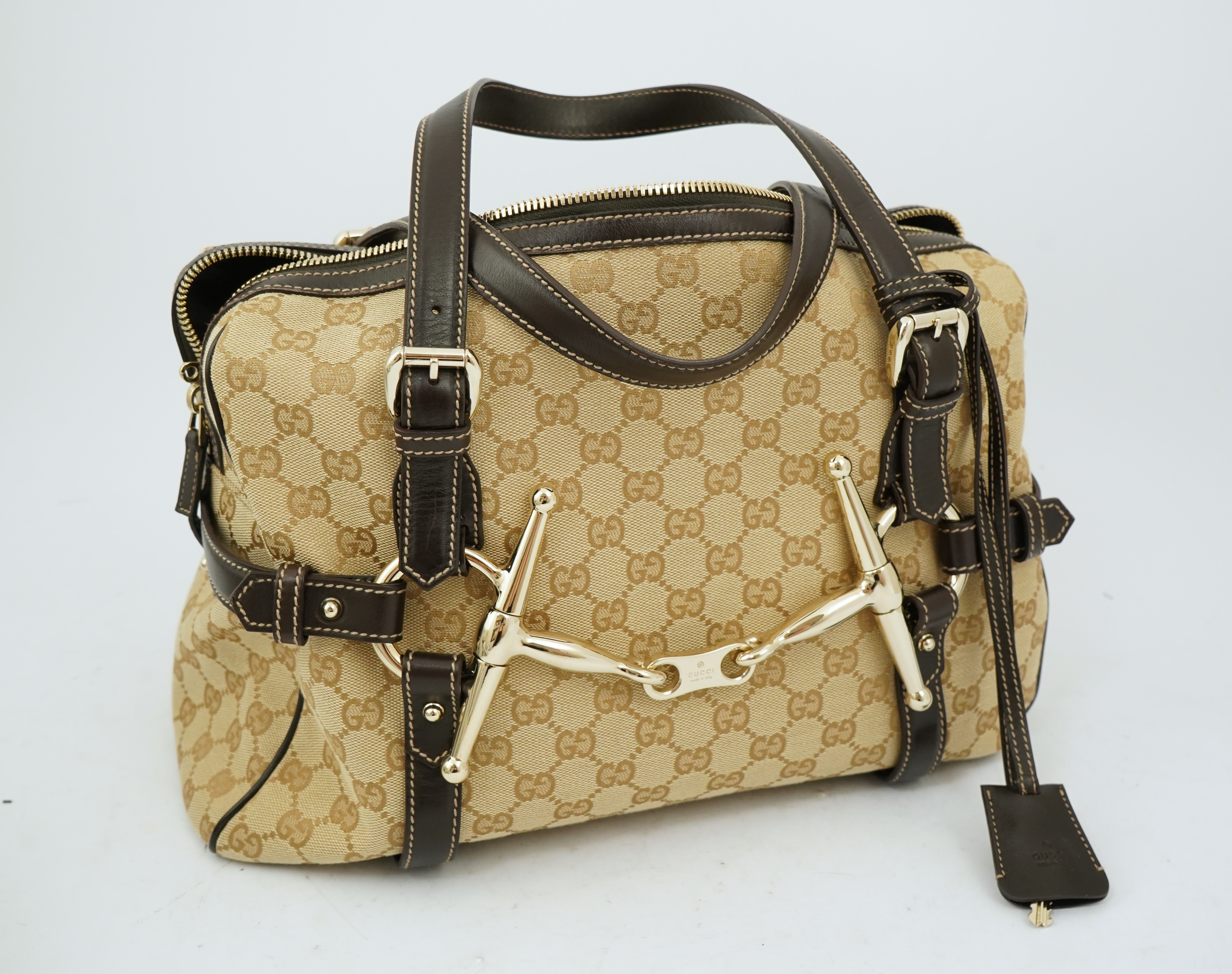 A vintage Gucci GG Classic Monogram Horsebit Shoulder Bag